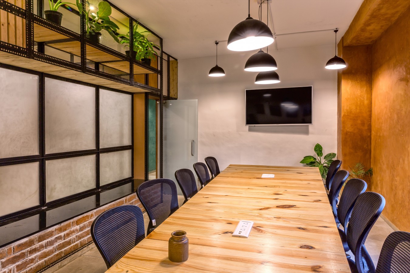 View of the Conference room with a backdrop of lunar white lime plaster and clay plaster