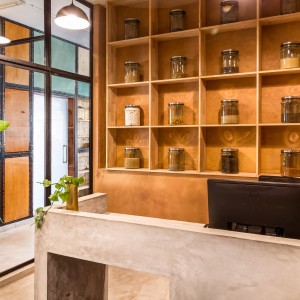 the display shelves behind the reception showcasing samples of organic grains